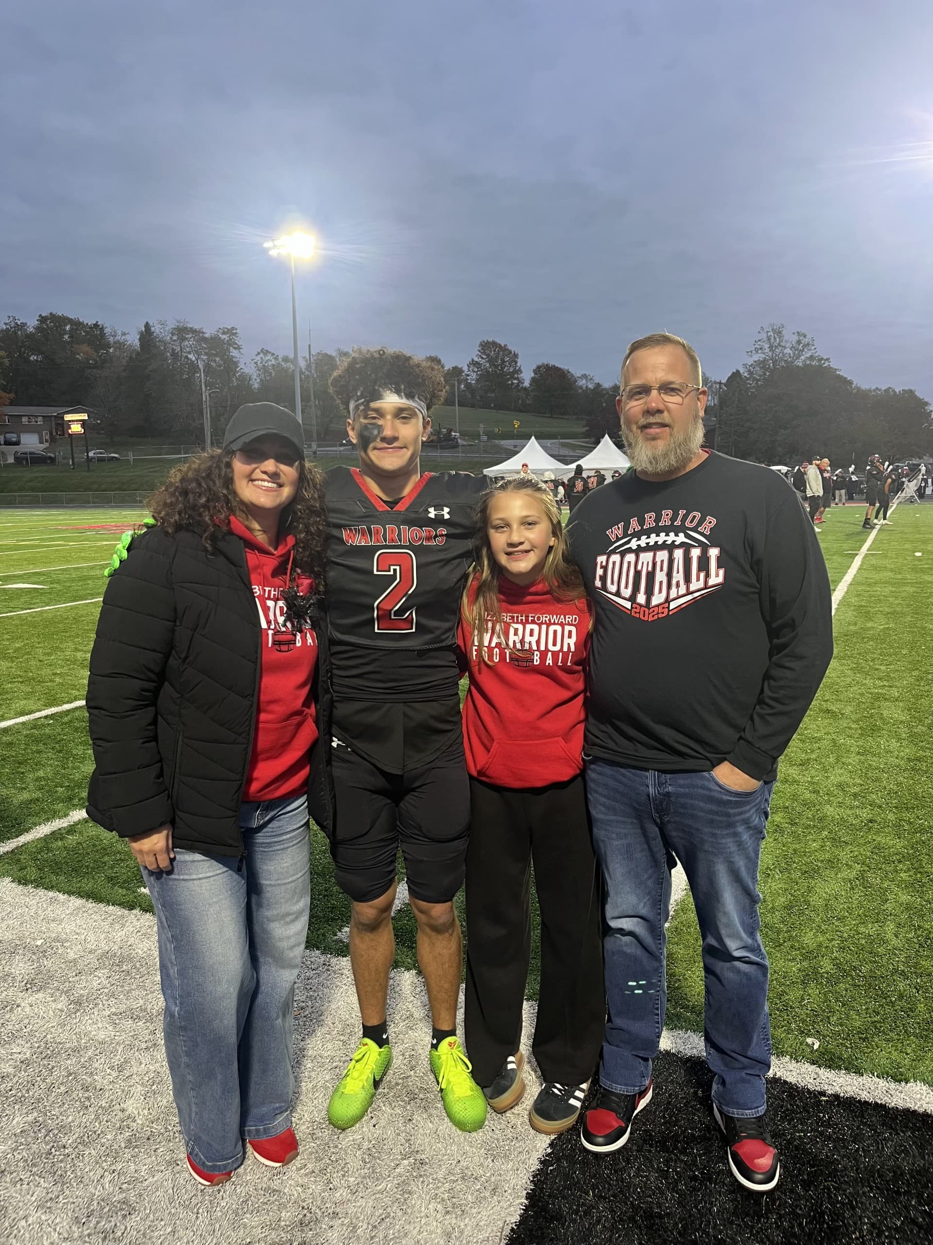 Champion Plumbing family at football game